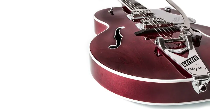 Elegant Gretsch electric guitar with rich wood finish and metal accents, perfect for music lovers.