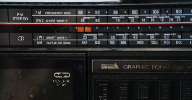 Close-up of a vintage stereo receiver showing frequency modulation and graphic equalizer.
