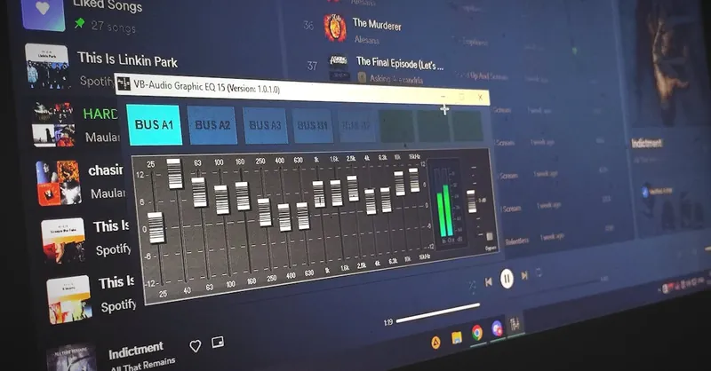 Close-up of a digital audio graphic equalizer on a laptop screen for music editing.